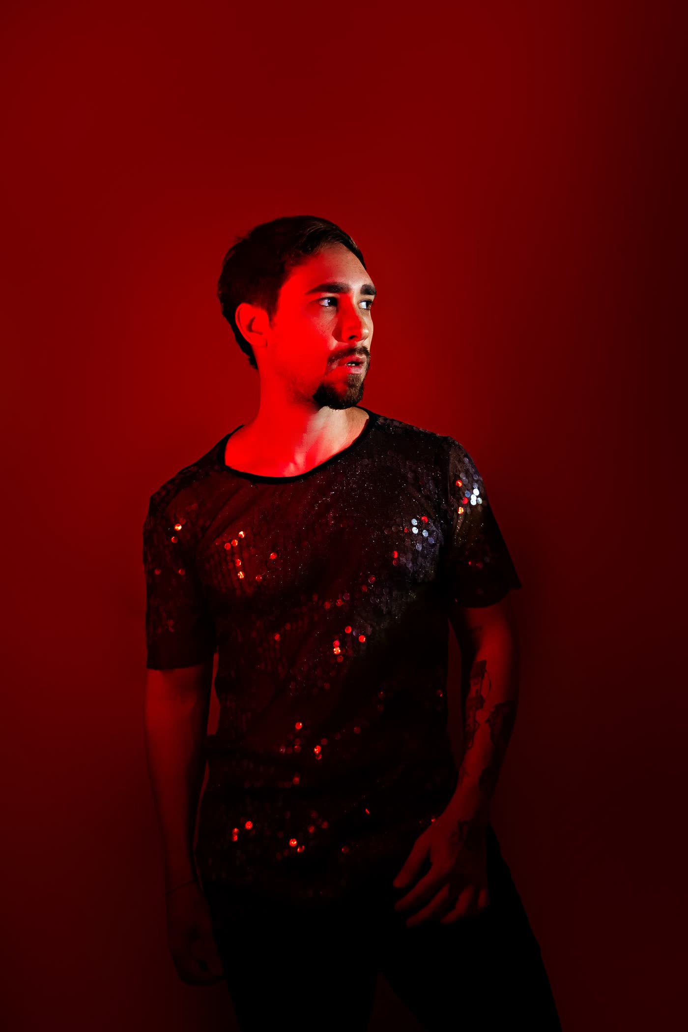 Dramatic male portrait rimmed in red light