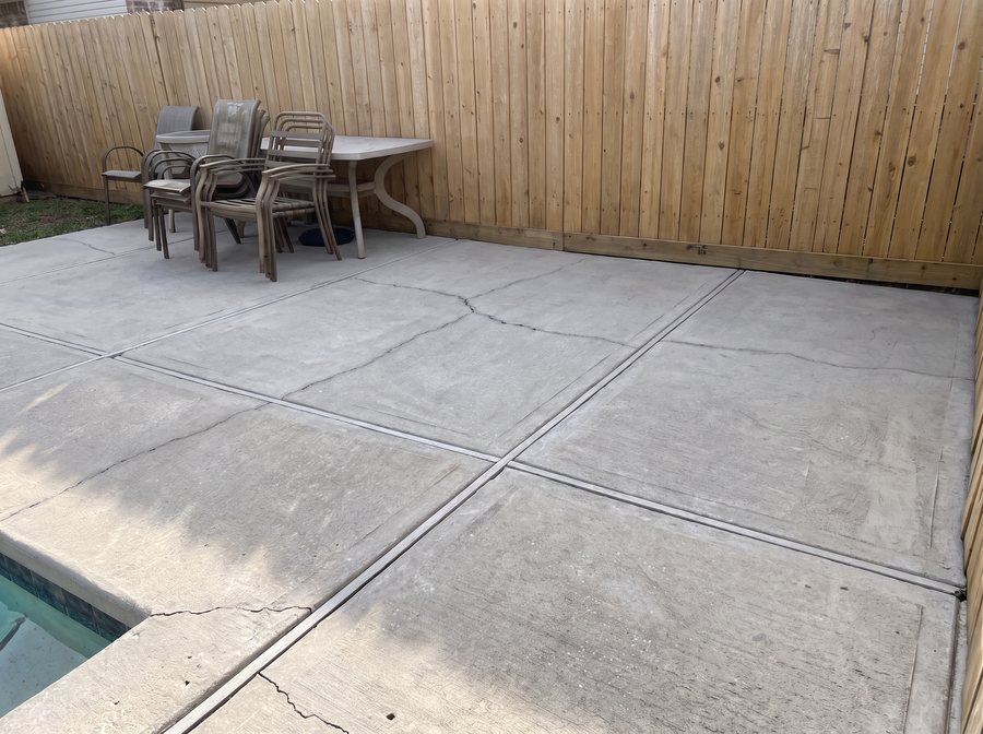 The pool patio after washing, the fence brightened.